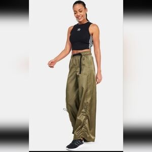 Adidas Originals wide-leg satin pants.